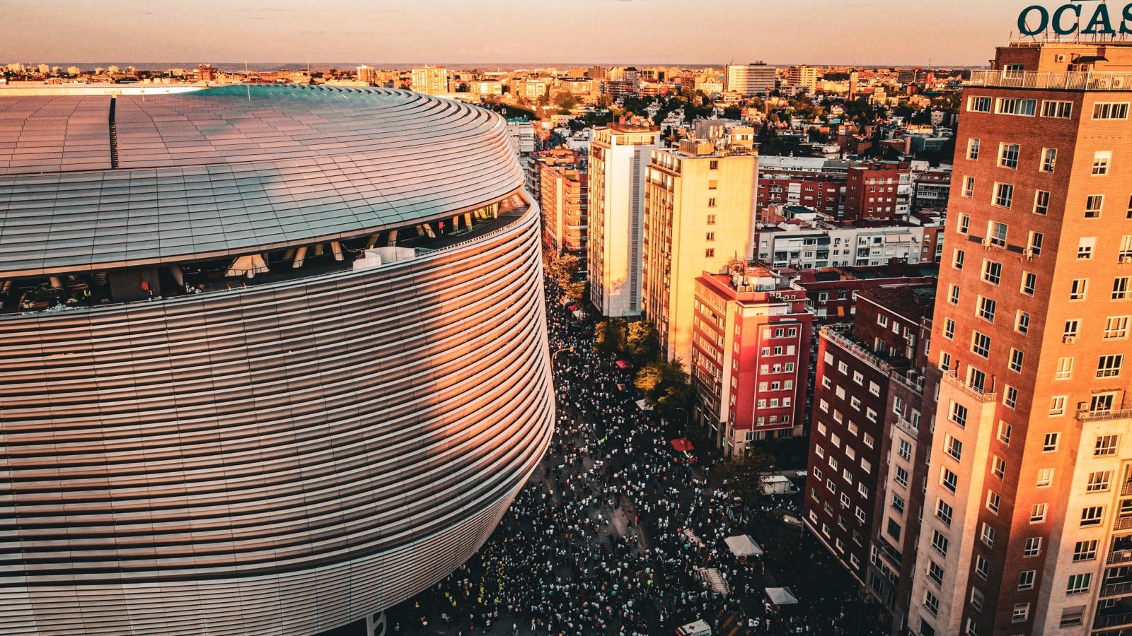 Crowds outside the Santiago Bernabéu at sunset